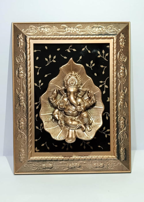 Ganesha sitting on a leaf in a flower design frame glossy look, Ganesh Frame Wall Hanging or even keep it on the table Decor for Living Room, Bedroom, Pooja Room, Dining Room, Office, Home Decoration